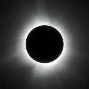 Total solar eclipse with the Sun's corona against a black sky